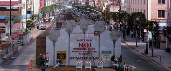 Movie still from “Speed” (1994), directed by Jan de Bont – A sign that is on the side of a building; Extreme Wide shot, High angle