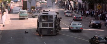 Movie still from “Speed” (1994), directed by Jan de Bont – A bus that has been wrecked on the side of the road; Wide shot, High angle