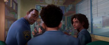 Movie still from “Spider-Man: Across the Spider-Verse” (2023), directed by Joaquim Dos Santos – A group of people standing in front of a painting; Close Up shot, Over the shoulder angle