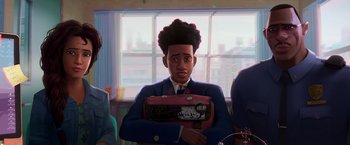 Movie still from “Spider-Man: Across the Spider-Verse” (2023), directed by Joaquim Dos Santos – A man holding a briefcase in front of a window; Medium shot, Over the shoulder angle