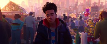 Movie still from “Spider-Man: Across the Spider-Verse” (2023), directed by Joaquim Dos Santos – A young man with curly black hair wearing a blue jacket; Medium shot, Over the shoulder angle