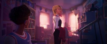 Movie still from “Spider-Man: Across the Spider-Verse” (2023), directed by Joaquim Dos Santos – A woman standing in a room with a book case in the background; Wide shot, Over the shoulder angle