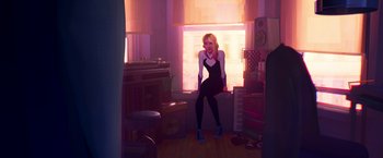 Movie still from “Spider-Man: Across the Spider-Verse” (2023), directed by Joaquim Dos Santos – A woman standing in front of a window in a room; Wide shot, Over the shoulder angle