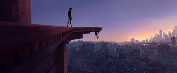 Movie still from “Spider-Man: Across the Spider-Verse” (2023), directed by Joaquim Dos Santos – A man standing on a ledge looking at a man falling off a building; Extreme Wide shot, Low angle