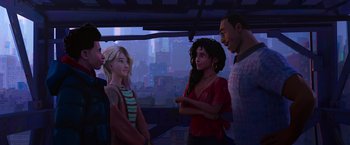 Movie still from “Spider-Man: Across the Spider-Verse” (2023), directed by Joaquim Dos Santos – A group of people standing next to each other in a room; Medium shot, Over the shoulder angle