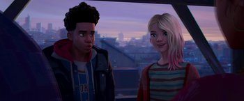 Movie still from “Spider-Man: Across the Spider-Verse” (2023), directed by Joaquim Dos Santos – A man and a woman standing next to each other in front of a city; Medium shot, Over the shoulder angle