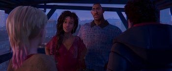 Movie still from “Spider-Man: Across the Spider-Verse” (2023), directed by Joaquim Dos Santos – An animated picture of a man and a woman standing next to each other; Medium shot, Over the shoulder angle