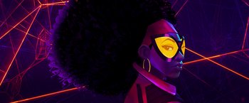 Movie still from “Spider-Man: Across the Spider-Verse” (2023), directed by Joaquim Dos Santos – An illustration of a woman with a large afro; Close Up shot, Low angle
