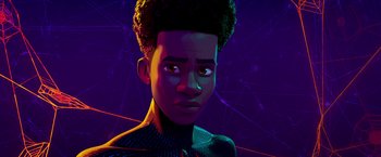 Movie still from “Spider-Man: Across the Spider-Verse” (2023), directed by Joaquim Dos Santos – An illustration of a young man in a purple neon light background; Close Up shot, Low angle
