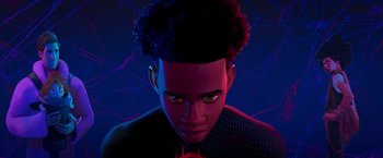 Movie still from “Spider-Man: Across the Spider-Verse” (2023), directed by Joaquim Dos Santos – A young man with a black jacket and a red tie; Close Up shot, Low angle