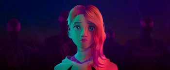 Movie still from “Spider-Man: Across the Spider-Verse” (2023), directed by Joaquim Dos Santos – A girl with pink and purple hair is looking at the camera; Close Up shot, Over the shoulder angle