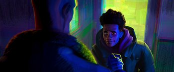 Movie still from “Spider-Man: Across the Spider-Verse” (2023), directed by Joaquim Dos Santos – An animated scene of a man holding a cell phone; Close Up shot, Over the shoulder angle