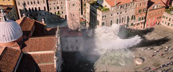 Movie still from “Spider-Man: Far from Home” (2019), directed by Jon Watts – An aerial view of a city with a clock tower in the middle of it; Extreme Wide shot, Overhead angle