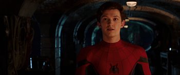 Movie still from “Spider-Man: Far from Home” (2019), directed by Jon Watts – A young man in a red spider - man costume; Close Up shot, Over the shoulder angle