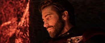 Movie still from “Spider-Man: Far from Home” (2019), directed by Jon Watts – A person with a beard looking to the side; Close Up shot, Over the shoulder angle