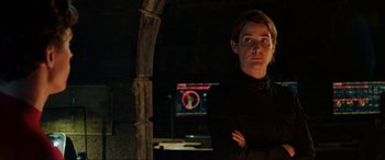 Movie still from “Spider-Man: Far from Home” (2019), directed by Jon Watts – A man standing in front of a computer screen; Medium shot, Low angle