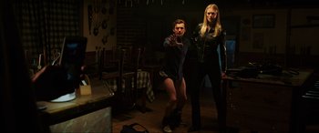 Movie still from “Spider-Man: Far from Home” (2019), directed by Jon Watts – A man and a woman are standing in a room; Wide shot, Low angle