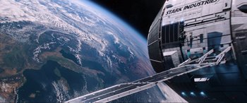 Movie still from “Spider-Man: Far from Home” (2019), directed by Jon Watts – A view of the earth taken from a space station window; Extreme Wide shot, Overhead angle