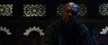 Movie still from “Spider-Man: Far from Home” (2019), directed by Jon Watts – A man in a black jacket with a black eye patch; Close Up shot, Over the shoulder angle