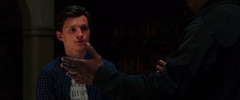Movie still from “Spider-Man: Far from Home” (2019), directed by Jon Watts – Two people are talking to each other in a dark room; Close Up shot, Over the shoulder angle