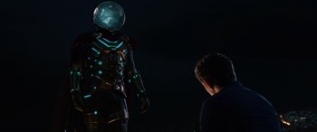 Movie still from “Spider-Man: Far from Home” (2019), directed by Jon Watts – A man is looking at a man in a suit; Medium shot, Over the shoulder angle