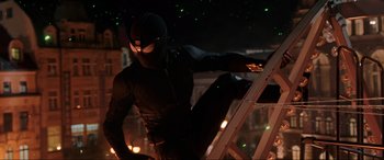 Movie still from “Spider-Man: Far from Home” (2019), directed by Jon Watts – A man standing on top of a ladder in the dark at night; Medium shot, Low angle