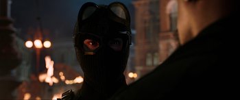 Movie still from “Spider-Man: Far from Home” (2019), directed by Jon Watts – A person wearing a mask and goggles in the dark; Close Up shot, Over the shoulder angle