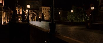 Movie still from “Spider-Man: Far from Home” (2019), directed by Jon Watts – Two people are walking on a sidewalk at night; Extreme Wide shot, High angle