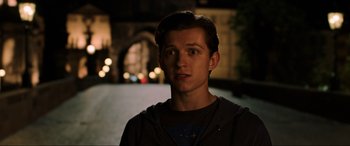 Movie still from “Spider-Man: Far from Home” (2019), directed by Jon Watts – A man standing in the street at night; Close Up shot, Over the shoulder angle