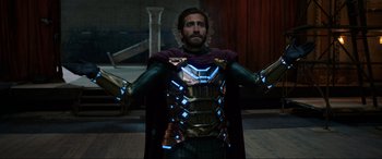 Movie still from “Spider-Man: Far from Home” (2019), directed by Jon Watts – A man in a costume is standing in a room; Medium shot, Low angle