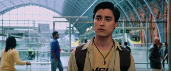 Movie still from “Spider-Man: Far from Home” (2019), directed by Jon Watts – A man in a tan shirt and brown jacket looking to his left; Close Up shot, Low angle