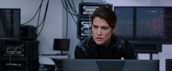 Movie still from “Spider-Man: Far from Home” (2019), directed by Jon Watts – A woman sitting in front of a computer; Close Up shot, Over the shoulder angle