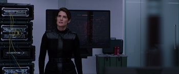 Movie still from “Spider-Man: Far from Home” (2019), directed by Jon Watts – A woman standing in front of a computer monitor; Medium shot, Over the shoulder angle