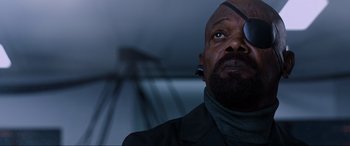 Movie still from “Spider-Man: Far from Home” (2019), directed by Jon Watts – A man wearing a suit and a tie; Close Up shot, Low angle