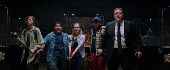 Movie still from “Spider-Man: Far from Home” (2019), directed by Jon Watts – A group of people standing next to each other; Medium shot, Low angle