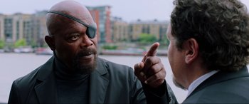 Movie still from “Spider-Man: Far from Home” (2019), directed by Jon Watts – A man wearing a pirate eye patch talking to another man; Close Up shot, Over the shoulder angle