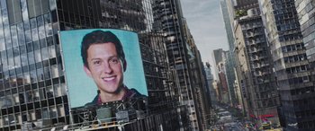 Movie still from “Spider-Man: No Way Home” (2021), directed by Jon Watts – A large poster of a man on the side of a tall building; Extreme Close Up shot, Over the shoulder angle