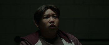 Movie still from “Spider-Man: No Way Home” (2021), directed by Jon Watts – A man in a brown shirt is looking up; Close Up shot, Low angle