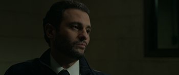 Movie still from “Spider-Man: No Way Home” (2021), directed by Jon Watts – A person wearing a suit and tie; Close Up shot, Low angle