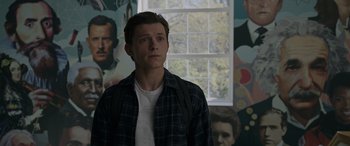 Movie still from “Spider-Man: No Way Home” (2021), directed by Jon Watts – A man standing in front of a wall with a window in the background; Close Up shot, Over the shoulder angle