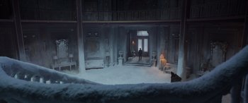 Movie still from “Spider-Man: No Way Home” (2021), directed by Jon Watts – A man standing in the middle of a room in the snow; Extreme Wide shot, High angle