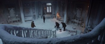 Movie still from “Spider-Man: No Way Home” (2021), directed by Jon Watts – A group of people cleaning snow off of a floor; Extreme Wide shot, High angle