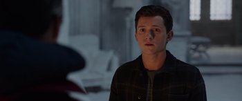 Movie still from “Spider-Man: No Way Home” (2021), directed by Jon Watts – A man in a plaid shirt is looking at the camera; Close Up shot, Over the shoulder angle