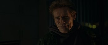 Movie still from “Spider-Man: No Way Home” (2021), directed by Jon Watts – A person wearing a hooded jacket; Close Up shot, Over the shoulder angle