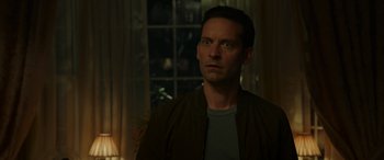 Movie still from “Spider-Man: No Way Home” (2021), directed by Jon Watts – A person wearing a jacket; Close Up shot, Over the shoulder angle