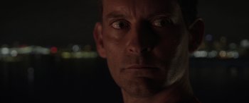 Movie still from “Spider-Man: No Way Home” (2021), directed by Jon Watts – A man's face in the dark; Close Up shot, Low angle