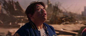 Movie still from “Spider-Man: No Way Home” (2021), directed by Jon Watts – A young man looking up into the sky; Close Up shot, Low angle