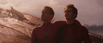 Movie still from “Spider-Man: No Way Home” (2021), directed by Jon Watts – Two men dressed in spider - man costumes looking up at the sky; Medium shot, Low angle