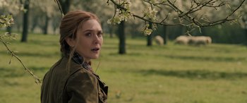 Movie still from “Spider-Man: No Way Home” (2021), directed by Jon Watts – A young woman standing in front of a tree; Close Up shot, Over the shoulder angle