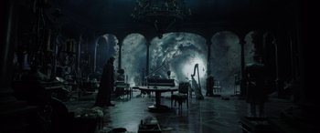 Movie still from “Spider-Man: No Way Home” (2021), directed by Jon Watts – A room filled with lots of furniture and a lot of smoke; Extreme Wide shot, High angle